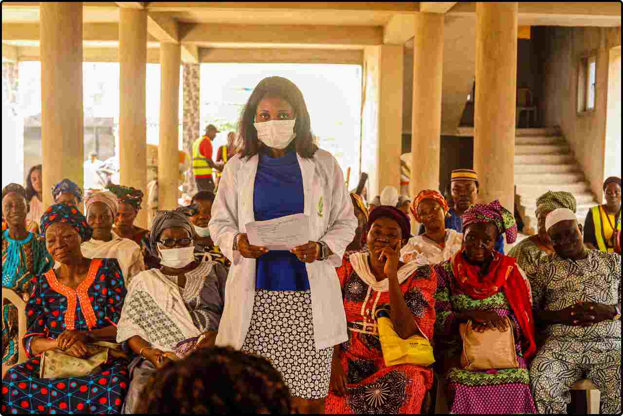 Doctor discussing health topics with elderly female patients.